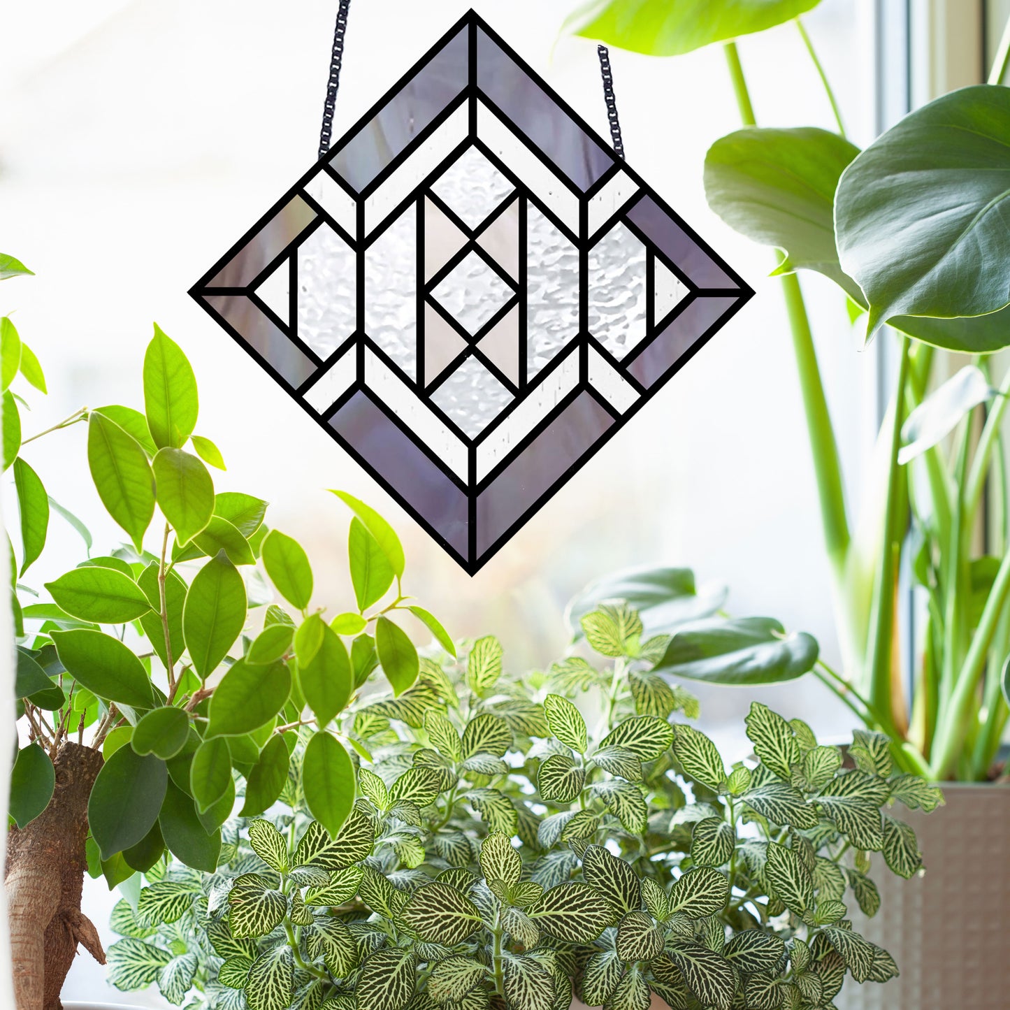 Beginner stained glass pattern for a diamond, instant PDF download, shown hanging in a window with plants