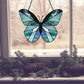 Beginner stained glass pattern for a butterfly, instant PDF download, shown hanging in a window with pine cones