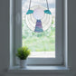 Boho circular stained glass pattern, instant pdf download, shown in a window with a plant