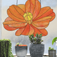 Stained glass pattern for a giant orange cosmos flower, instant PDF download, shown hanging in a window with succulents