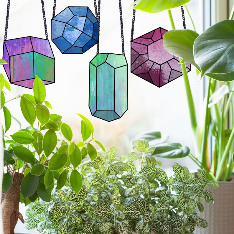Beginner stained glass pattern for four crystals and gems, instant PDF download, shown hanging in a bright sunny window with plants