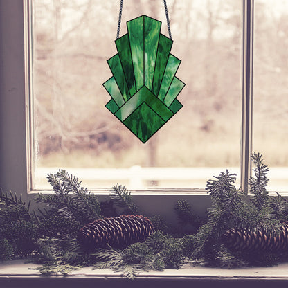 Beginner leaf, stained glass pattern, shown in a window with pine cones