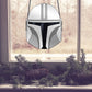 The Mandalorian Star Wars helmet stained glass pattern, instant pdf download, shown in window with pine cones