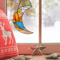 Stained glass pattern for a boho landscape crescent moon, instant PDF download, shown in a window with Christmas decorations