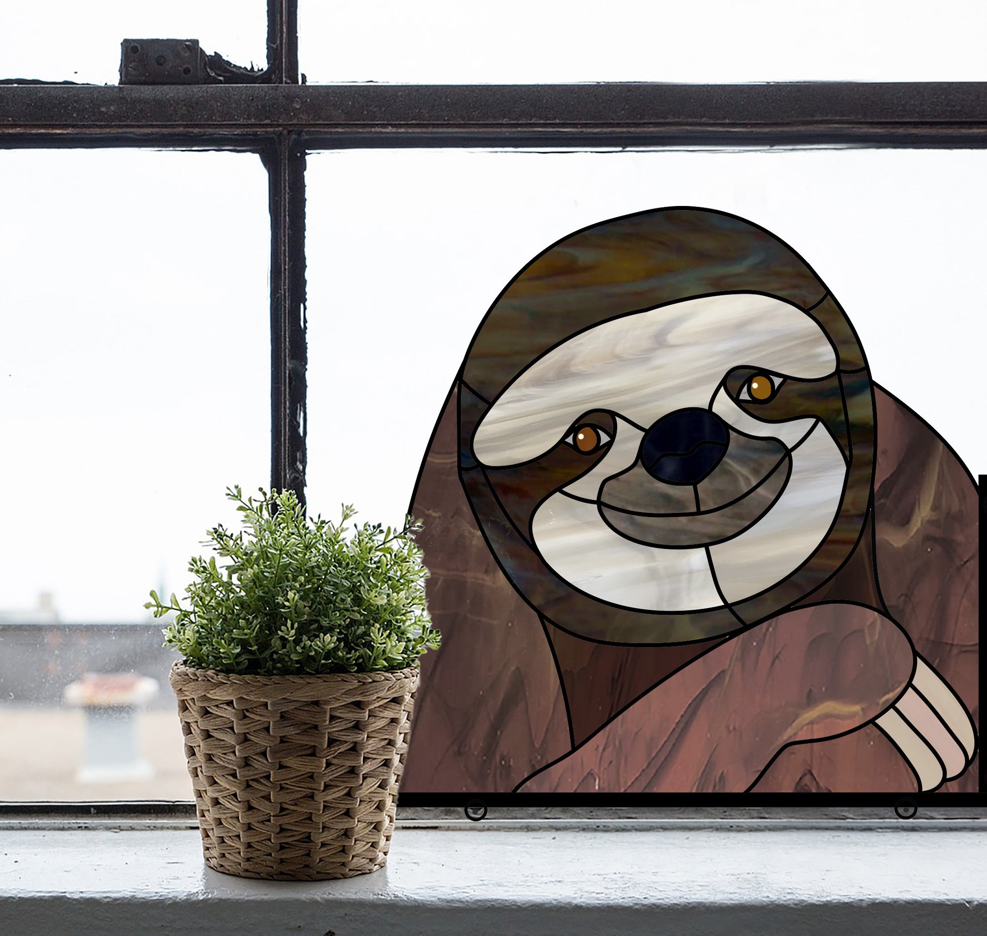 Stained glass pattern for a sloth peeking in the window, instant PDF download, shown in a window with a plant