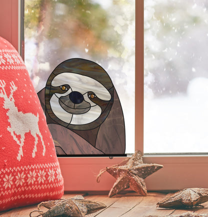 Stained glass pattern for a sloth peeking in the window, instant PDF download, shown in a window with Christmas decor