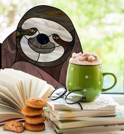 Stained glass pattern for a sloth peeking in the window, instant PDF download, shown in a window with hot chocolate and cookies