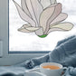 Stained glass pattern for a giant white snowdrop flower, instant PDF download, shown hanging in a window with a sweater and some tea