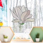 Stained glass pattern for a giant white snowdrop flower, instant PDF download, shown hanging in a window with a snowy background
