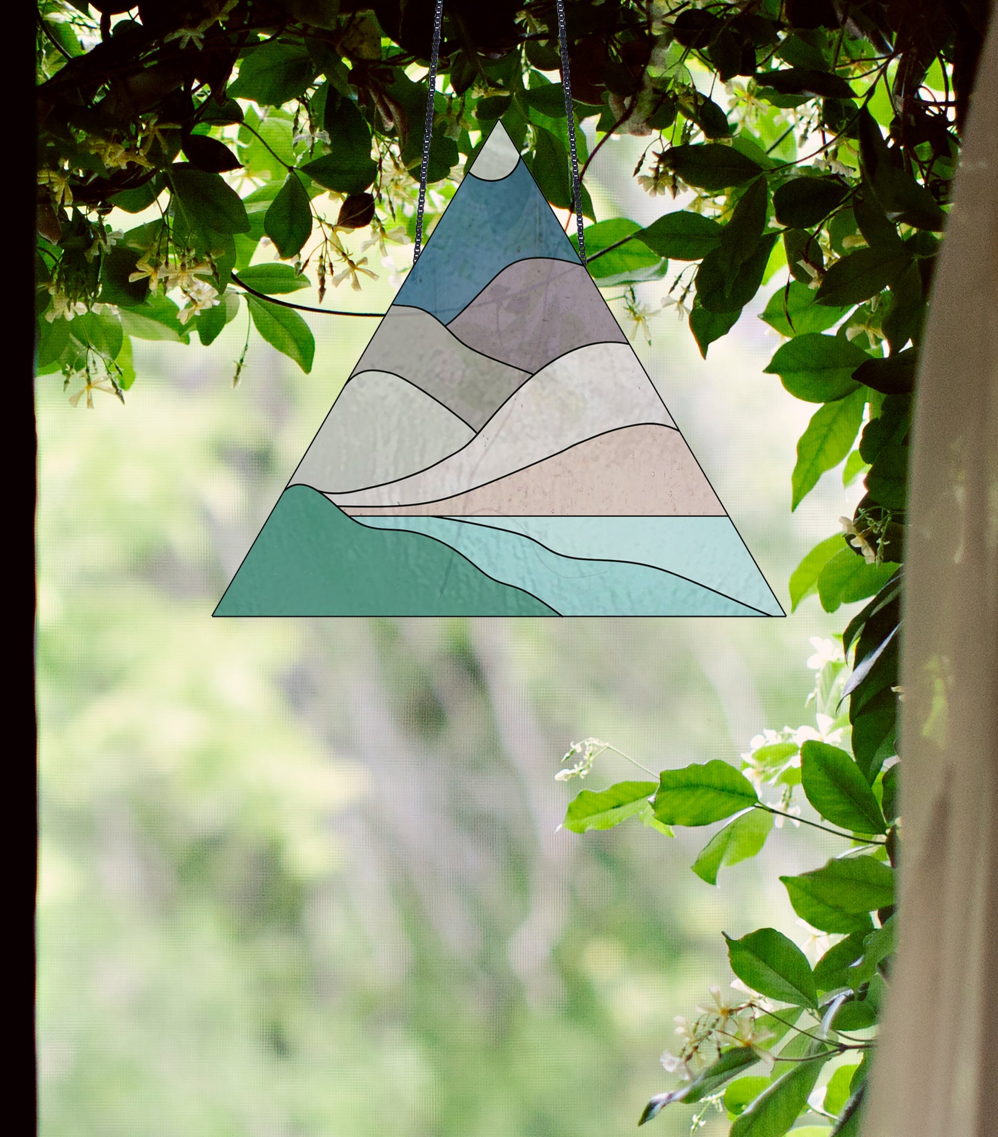 Triangle stained glass pattern for a boho landscape, instant PDF download, shown in a window with ivy